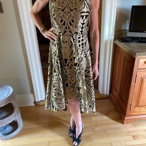 Brand new without tags Frank Lyman size 8 High low dress gold pattern throughout